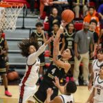 Lawrence High boys relinquish late lead, fall to Topeka High in 66-65 thriller